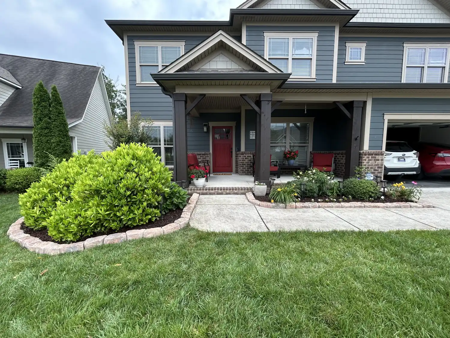 A clean, professionally landscaped craftsman home by JM Landscaping